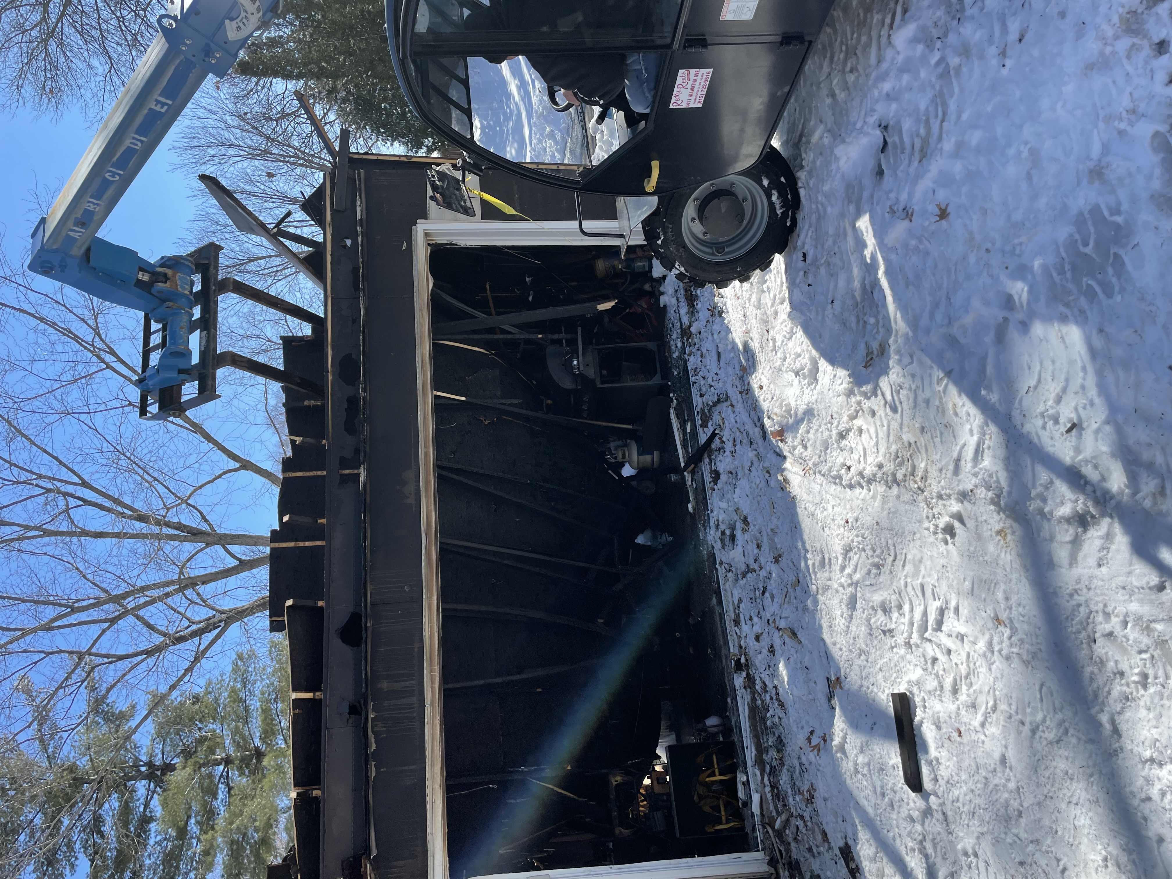 Fire and smoke damage restoration showing burned walls, soot, and structural repairs needed